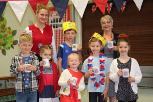 Cllr Lazenby presenting the Celebratory mugs to Ms Dumpleton Deputy Head 